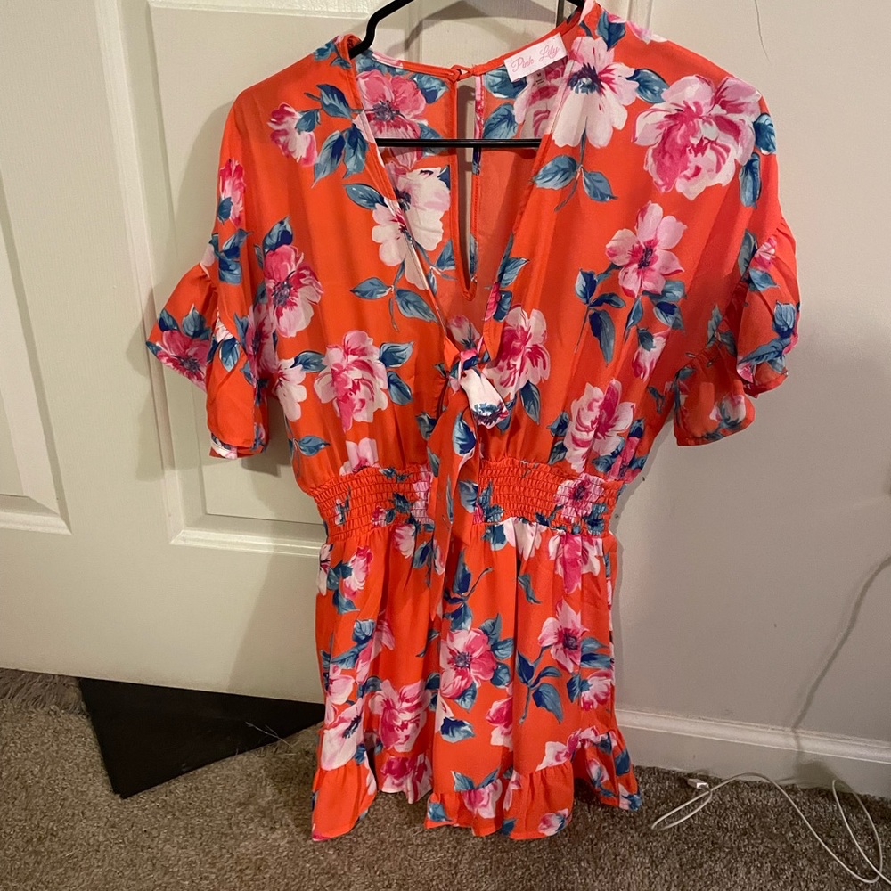 Orange Flower romper never worn from pink Lily boutique